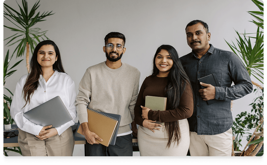 Four Get Scholify team members standing together in an office