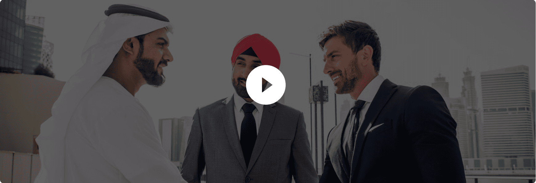 Three business leaders from different backgrounds meeting on a rooftop